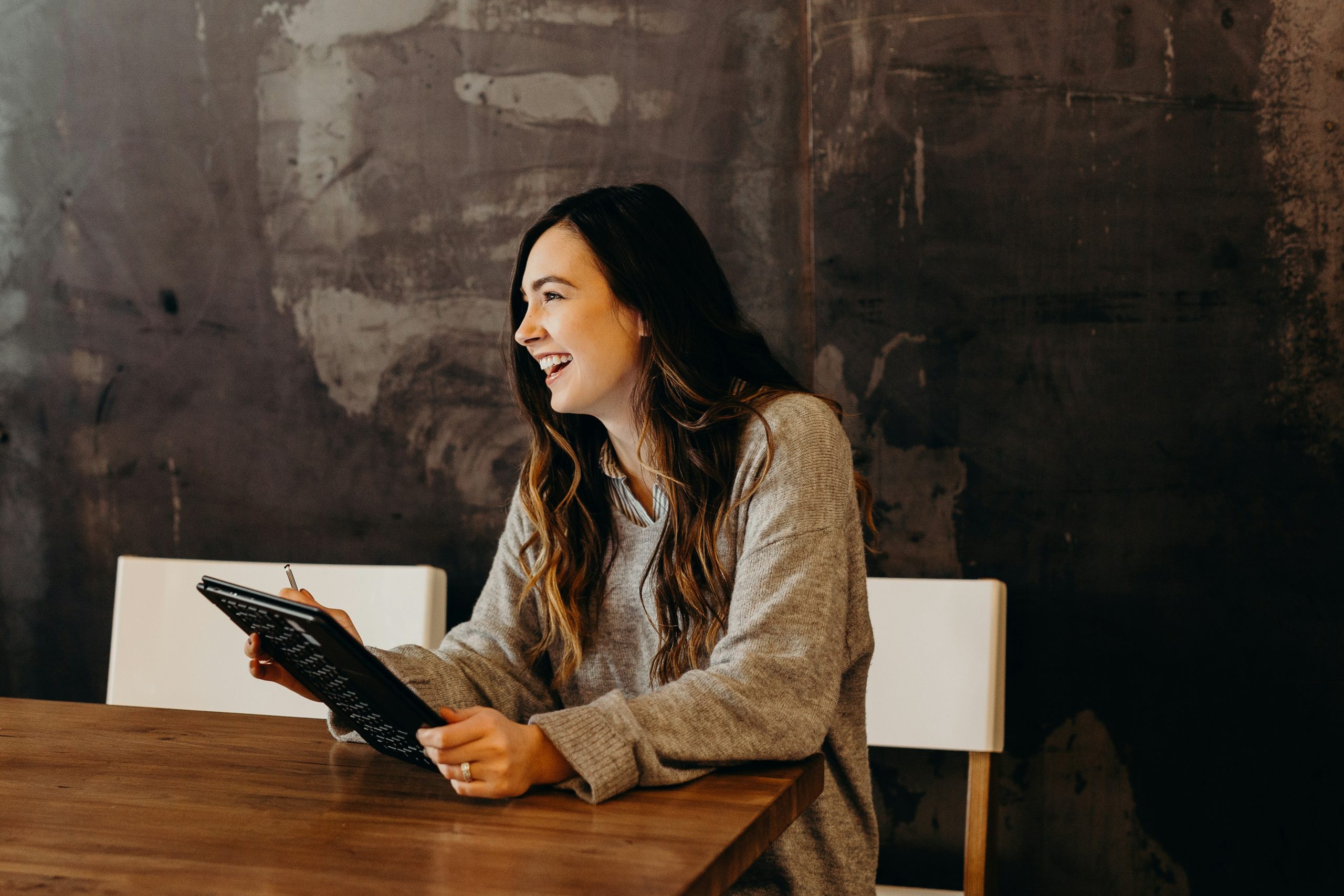 Girl smiling with ipad